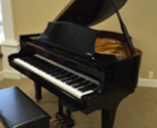 Story & Clark player grand piano