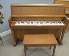 Super clean, dark oak Kawai studio piano